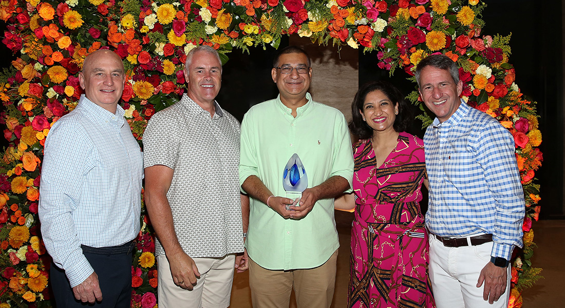employee being awarded with trophy during incentive travel trip